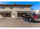 Apartment building with parking spaces and visible cars at 4714 E Belleview St, Phoenix, AZ 85008