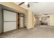 Open bedroom featuring a ceiling fan, carpet flooring and custom built-in closet, offering comfort and convenience at 4837 E Avalon Dr, Phoenix, AZ 85018