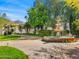 Beautiful tiered water fountain with lush landscaping and walking path in the property's backyard at 4900 E Desert Fairways Dr, Paradise Valley, AZ 85253