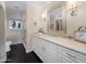 This bathroom has a white vanity with double sinks, a large mirror, and lots of storage space at 4900 E Desert Fairways Dr, Paradise Valley, AZ 85253