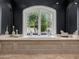 Luxurious bathroom with a soaking tub, and a large window with a view of the garden at 4900 E Desert Fairways Dr, Paradise Valley, AZ 85253