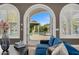 View from the living room to the private pool with a covered patio at 4900 E Desert Fairways Dr, Paradise Valley, AZ 85253