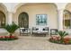 Elegant outdoor patio with stylish furniture and potted plants, perfect for relaxing and entertaining at 4900 E Desert Fairways Dr, Paradise Valley, AZ 85253