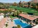 This beautiful backyard oasis has a large pool and a covered outdoor bar area at 4900 E Desert Fairways Dr, Paradise Valley, AZ 85253