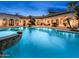 Beautiful courtyard pool featuring classic architecture and serene lighting, creating a luxurious outdoor oasis at 4900 E Desert Fairways Dr, Paradise Valley, AZ 85253