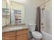Bathroom with granite countertop and view to kitchen at 525 N Miller Rd # 220, Scottsdale, AZ 85257