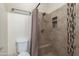 Bathroom with shower and decorative tile at 525 N Miller Rd # 220, Scottsdale, AZ 85257