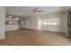 Spacious living room featuring beautiful wood flooring, a ceiling fan, and natural light at 525 N Miller Rd # 220, Scottsdale, AZ 85257