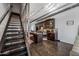 Modern eat-in kitchen featuring stainless steel appliances, granite counters, and metal staircase at 541 E Ames Pl, Phoenix, AZ 85004