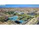 Expansive aerial view of the neighborhood with community pool, play areas and lush landscaping at 5611 S Feliz --, Mesa, AZ 85212