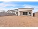 View of the backyard showcasing the covered patio, block wall, and potential for outdoor enjoyment at 5611 S Feliz --, Mesa, AZ 85212