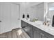 Modern bathroom featuring double vanity, a shower, and sleek black hardware at 5611 S Feliz --, Mesa, AZ 85212