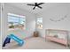 Bedroom featuring natural light, a crib, and a blue slide at 5611 S Feliz --, Mesa, AZ 85212