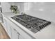 Close-up of the cooktop in the kitchen, with stainless steel knobs and a sleek design at 5611 S Feliz --, Mesa, AZ 85212