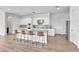 Bright kitchen features an island with seating and ample counter space, perfect for entertaining at 5611 S Feliz --, Mesa, AZ 85212