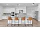 Modern kitchen boasts white cabinets, stainless steel appliances, and a large island with seating at 5611 S Feliz --, Mesa, AZ 85212