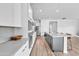 Gourmet kitchen featuring sleek cabinetry, stainless appliances, and a center island with bar seating at 5611 S Feliz --, Mesa, AZ 85212