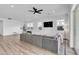 Modern living room features recessed lighting, a large sectional, and plenty of natural light at 5611 S Feliz --, Mesa, AZ 85212