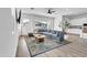 Open concept living room with modern décor, large windows, and a comfortable sectional sofa at 5611 S Feliz --, Mesa, AZ 85212