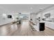Inviting open floorplan showcasing the kitchen, living, and dining areas with natural light at 5611 S Feliz --, Mesa, AZ 85212