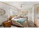 Comfortable bedroom featuring a large bed, bedside tables, and ample closet space at 5735 E Mcdowell Rd # 147, Mesa, AZ 85215