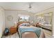 Cozy bedroom with soft bedding, bedside tables, and a mirrored closet at 5735 E Mcdowell Rd # 147, Mesa, AZ 85215