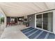 Spacious covered patio featuring a seating area, bar, and access to the home at 5735 E Mcdowell Rd # 147, Mesa, AZ 85215