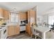 Efficient kitchen with ample cabinet space and an adjacent dining area at 5735 E Mcdowell Rd # 147, Mesa, AZ 85215