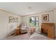 Inviting sitting room with comfortable chair, desk, and a view to the outside at 5735 E Mcdowell Rd # 147, Mesa, AZ 85215