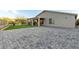 Wide angle view of the backyard showing patio, neutral brick pavers and exterior at 6404 W Black Hill Rd, Phoenix, AZ 85083