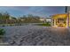 Spacious backyard showcasing the extended patio area with a lush lawn and privacy fence at 6404 W Black Hill Rd, Phoenix, AZ 85083