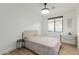 Bedroom with hardwood floors, soft lighting, and a neutral color palette at 6404 W Black Hill Rd, Phoenix, AZ 85083