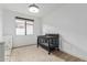 Bedroom with wood floors, neutral rug and a large window at 6404 W Black Hill Rd, Phoenix, AZ 85083