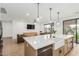 Bright open-concept kitchen view, showcases living area, kitchen island, and stainless appliances at 6404 W Black Hill Rd, Phoenix, AZ 85083