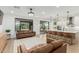 Bright open-concept living room with sliders leading to the backyard and outdoor living area at 6404 W Black Hill Rd, Phoenix, AZ 85083