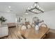 Bright living space featuring wood floors, modern lighting, and a inviting open layout at 6404 W Black Hill Rd, Phoenix, AZ 85083