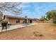 Large backyard with string lights, patio area, and barbecue, perfect for relaxing at 6917 E Flossmoor Ave, Mesa, AZ 85208