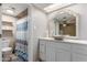 Bright bathroom featuring a modern vessel sink, vanity, and shower at 6917 E Flossmoor Ave, Mesa, AZ 85208