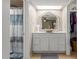 Bright bathroom featuring a modern vessel sink, vanity, and stylish mirror at 6917 E Flossmoor Ave, Mesa, AZ 85208