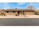 Charming single-story brick home with a two car garage and desert landscaping at 6917 E Flossmoor Ave, Mesa, AZ 85208