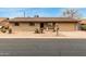 Charming single-story brick home with a two car garage and desert landscaping at 6917 E Flossmoor Ave, Mesa, AZ 85208