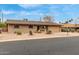 Lovely single-story brick home with desert landscaping and an attached two car garage at 6917 E Flossmoor Ave, Mesa, AZ 85208