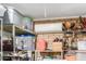 Garage shelves with storage containers and equipment at 6917 E Flossmoor Ave, Mesa, AZ 85208
