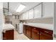 Functional laundry room with ample counter space, cabinets, and modern appliances at 6917 E Flossmoor Ave, Mesa, AZ 85208