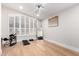 Minimalist bedroom with a treadmill, electric drum set, and a gold framed mirror at 7849 W Kristal Way, Glendale, AZ 85308