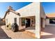 Exterior view of covered patio that includes brick and concrete flooring and shade at 7849 W Kristal Way, Glendale, AZ 85308