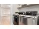 Modern laundry room with stainless steel washer and dryer at 7849 W Kristal Way, Glendale, AZ 85308