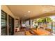 Inviting covered patio with ample seating and dining space, perfect for outdoor gatherings at 7849 W Kristal Way, Glendale, AZ 85308