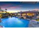 Backyard pool and patio area with outdoor seating, ideal for relaxing and entertaining guests at 9677 E Gold Dust Ave, Scottsdale, AZ 85258