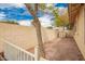 Private backyard with gravel landscaping, mature trees, and a storage shed, offering a serene outdoor space at 9859 W Irma Ln, Peoria, AZ 85382